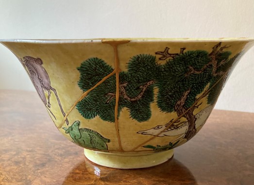 Figure 1: Ceramic bowl reassembled using epoxy and gold paint to celebrate the cracks that formed after a break as an integral part of the beauty of the bowl.