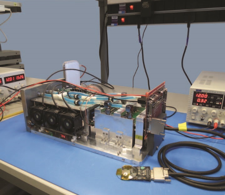 Figure 3: Chassis of the Tristan 1M with all the electronics installed. The system currently drives a single Timepix3 chip connected to the rest of the electronics through an adapter board and a cable as shown in the picture.