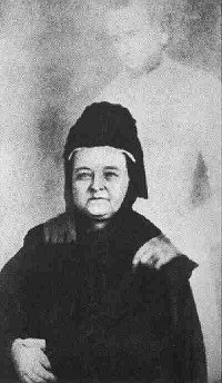 Mary Todd Lincoln with the 'ghost' of her husband, taken by spirit photographer William H. Mumler. Mumler's photos are now considered hoaxes