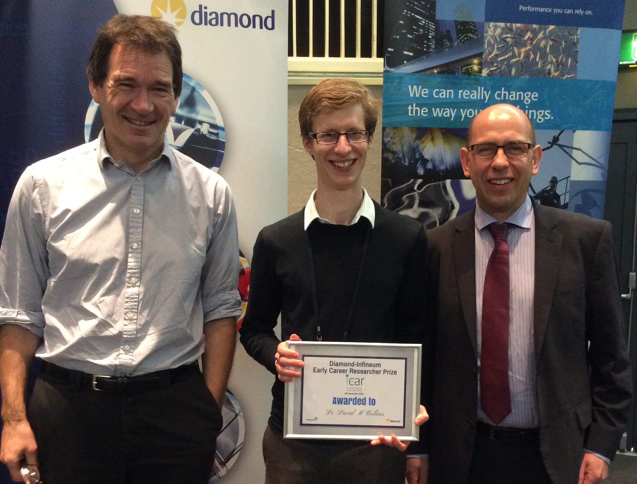 David accepting his award at the 2015 iCAR conference
<br/>
<br/>L to R: Andrew Harrison (CEO Diamond Light Source), David Collins (Early Career Researcher Prize Winner) and Chris Locke (EVP of Marketing and Technology (Infineum)