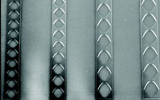 A planar refractive X-ray lens made of nano-crystalline diamond 
