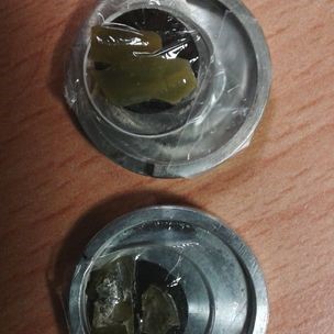 Close view of an algae sample, post cadmium adsorption experiments, prepared for loading into cryostat for the X-Ray Florescence and X-Ray Absorption Spectroscopy measurements at I18 Microfocus spectroscopy beamline at the Diamond Light Source. Image credit Loredana Brinza.