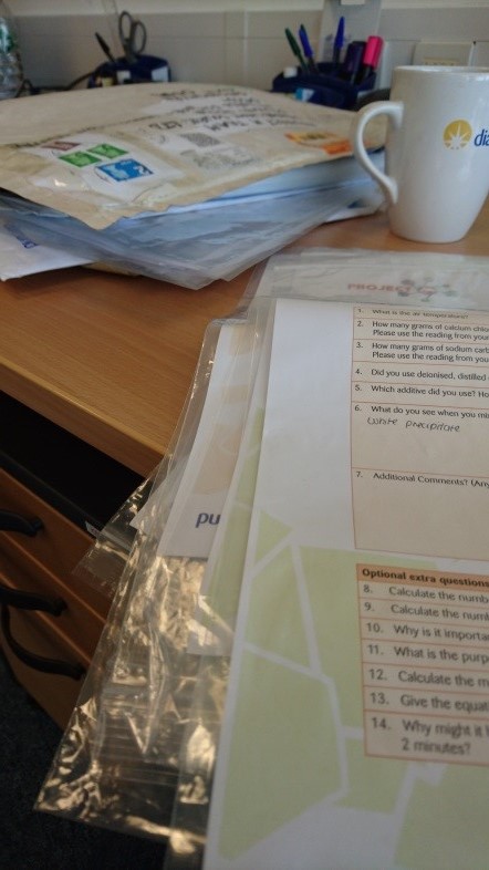 Cross-checking some of the paperwork, helped along by the (free!) tea. 