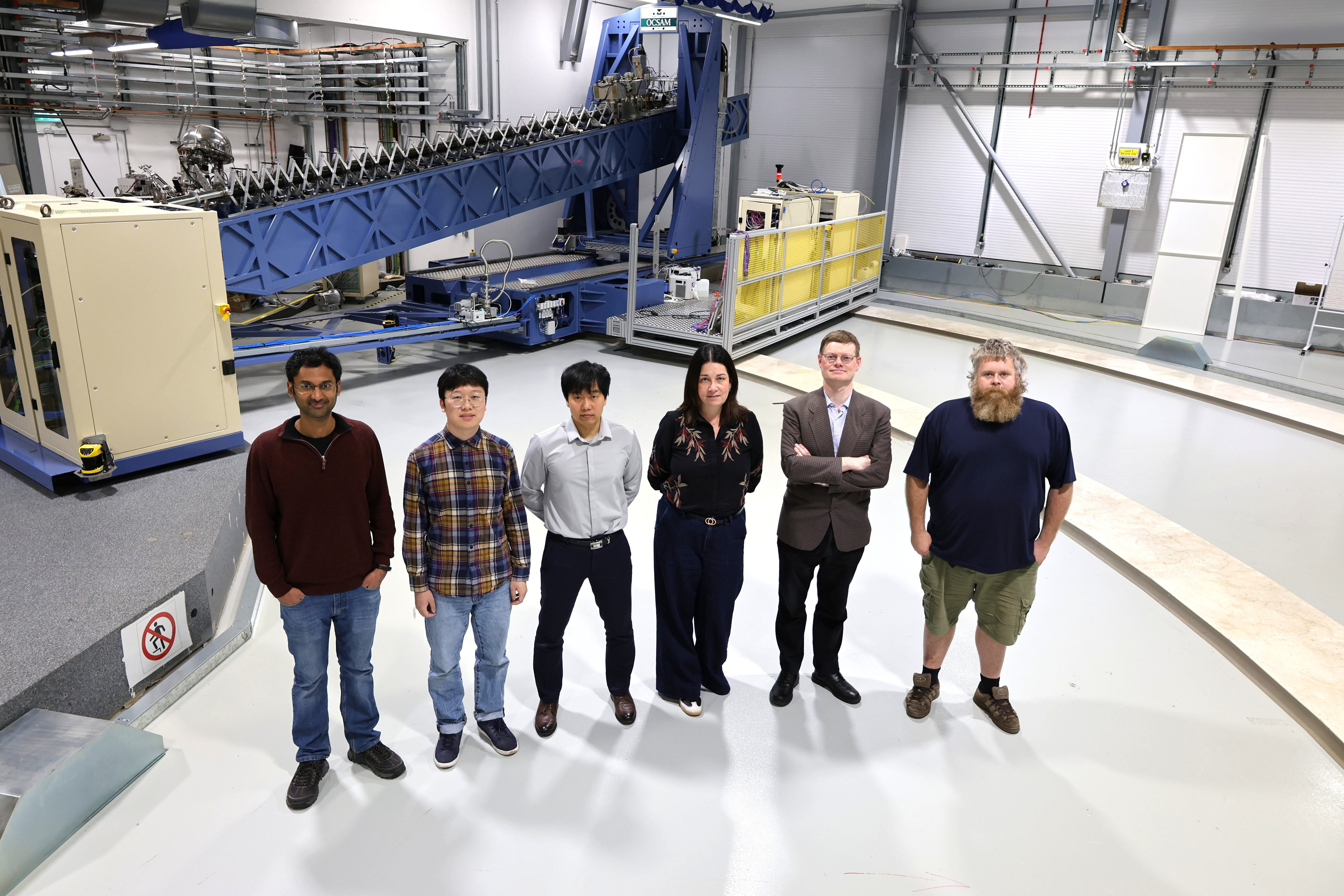 The I21 team alongside the beamline spectrometer.