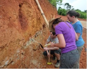 Dr Guillaume Estrade, Dr Eva Marquis and Dr Kathryn Goodenough taking samples from soil profiles and the volcanic rocks
