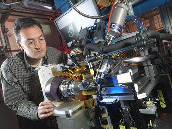 Ralf Flaig, Principal Beamline Scientist on I04 works on the beamline