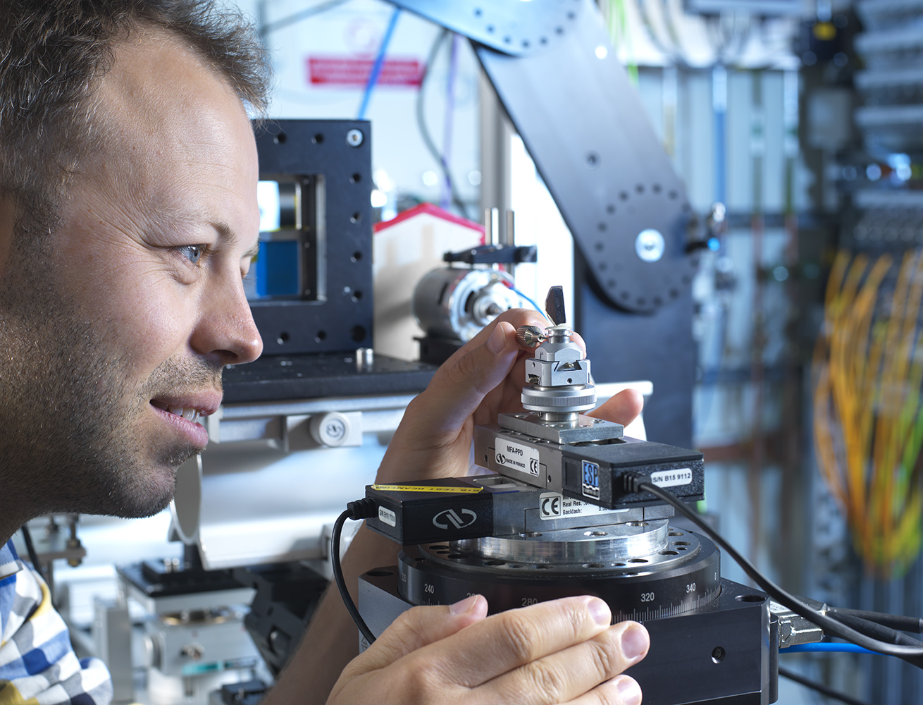  Dr Matt Pankhurst studies one of the moon rock samples from the Apollo 12 & 15 missions at Diamond Light Source