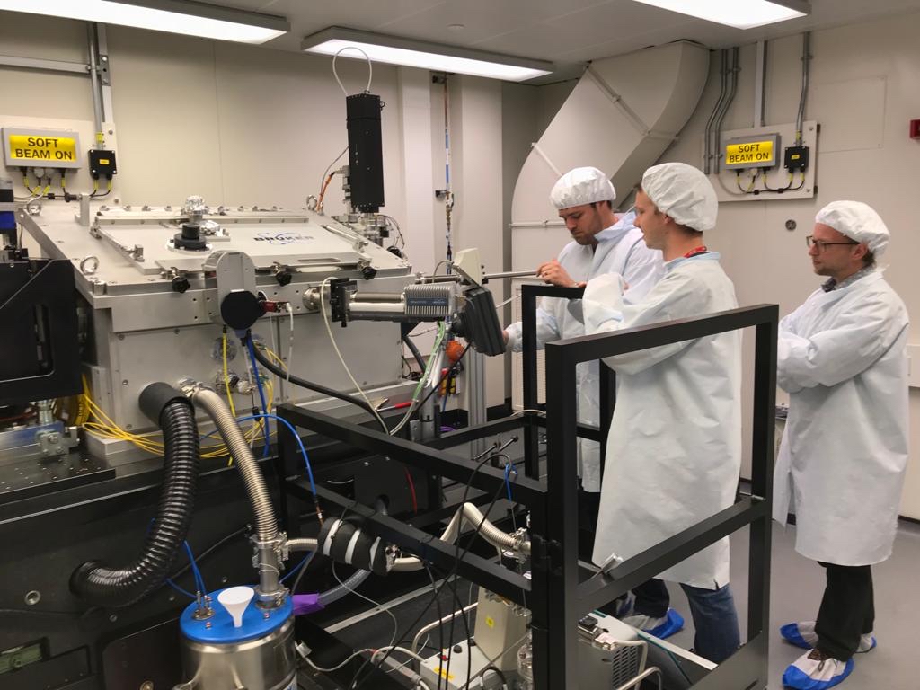 Experimental team in beamline I08 at Diamond. From left to right: James Everett, Jake Brooks, Frederik Lermyte. Image: University of Keele.