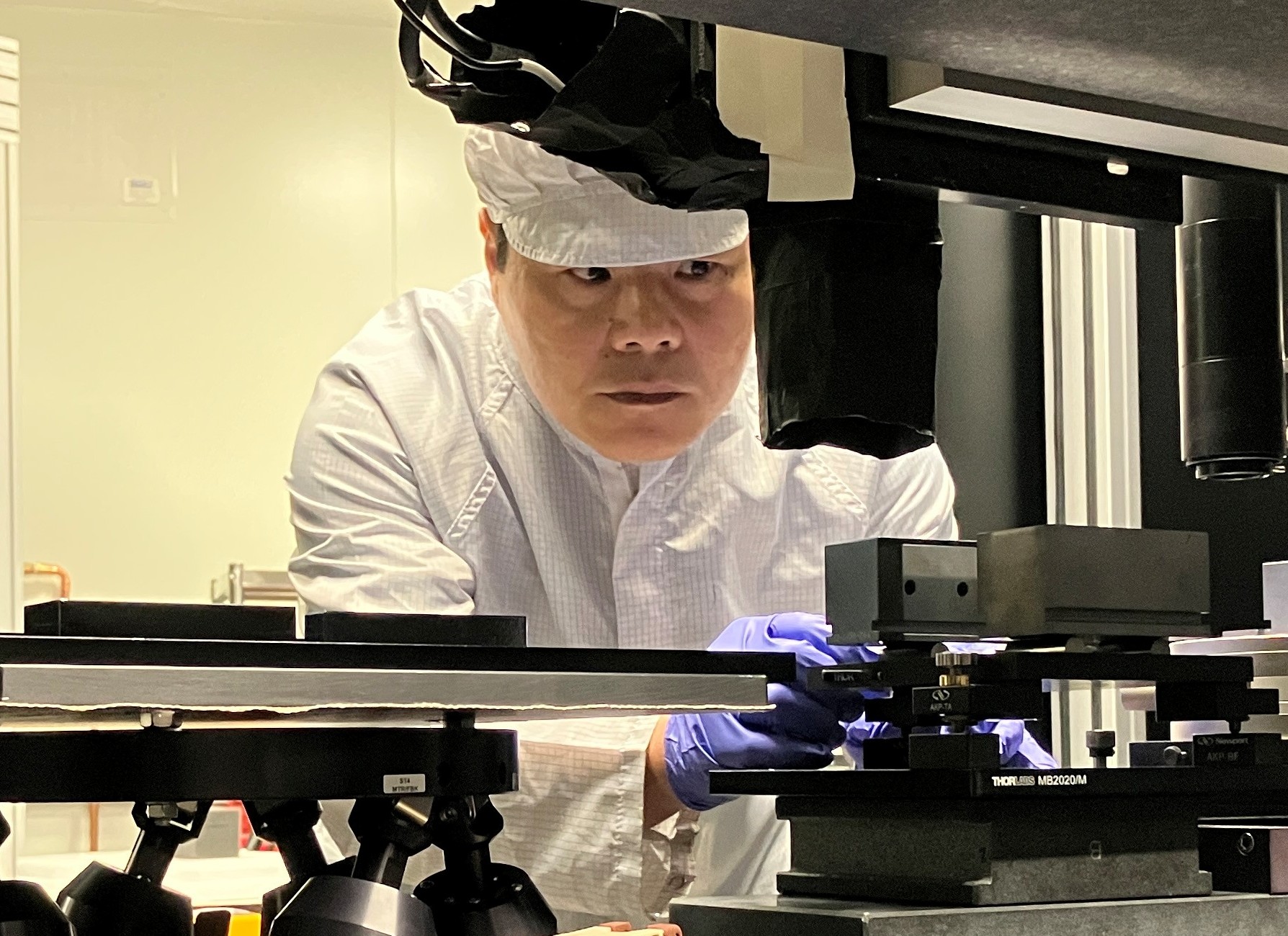 Dr Hongchang Wang is aligning the optics for the measurement with SCOM system